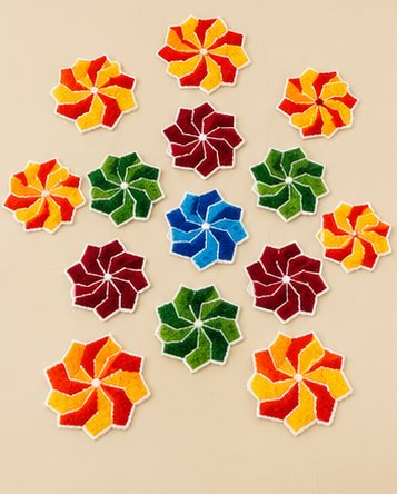 Colourful rangoli flower accent pieces